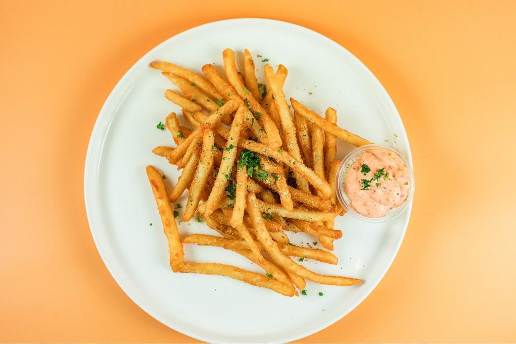 House Fries at Santorini's Sandy: Lemon-herb seasoned fries served with Tzatziki and Roasted Pepper sauces. A flavorful side!