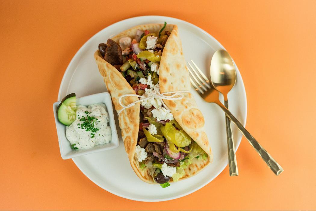 Original Pita at Santorini's Farmington: Choice of gyro or lemon chicken with feta and Tzatziki. A 5-time Best of State winner!
