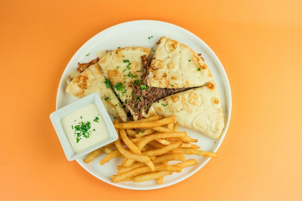 Braised Beef Melt at Santorini&rsquo;s Farmington: Slow-cooked beef, mozzarella, and roasted garlic. A must-try at Farmington Station!