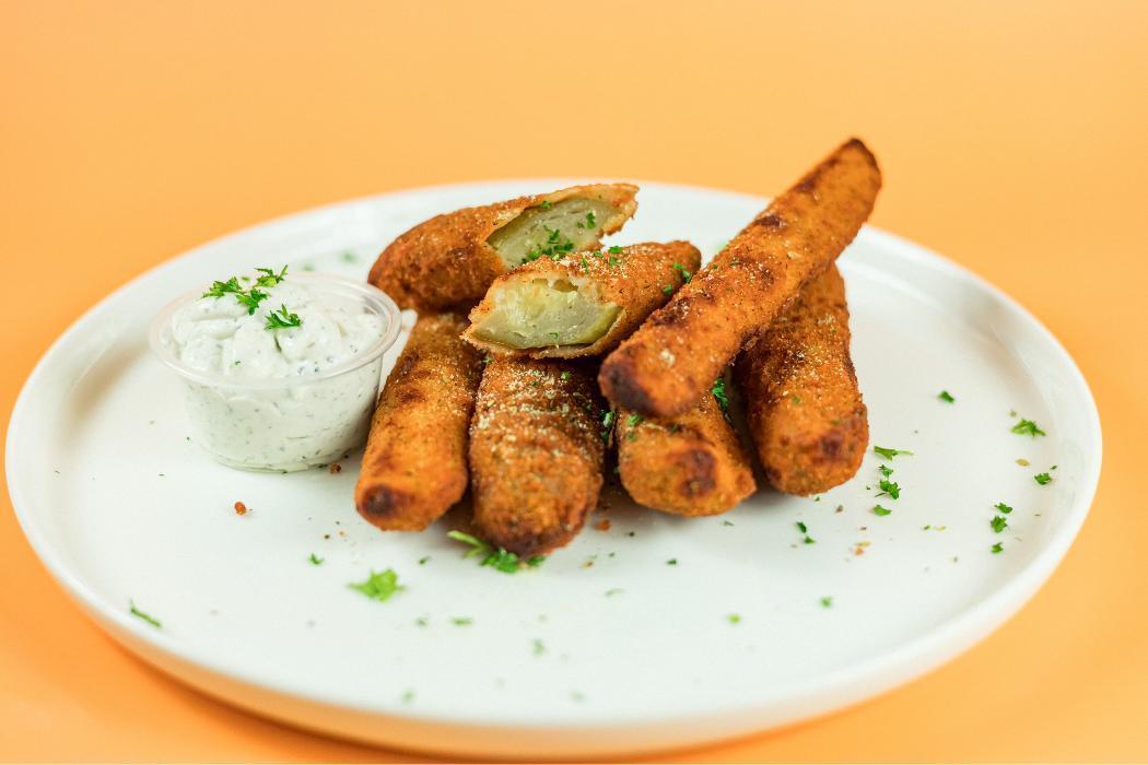 Fried Pickles at Santorini's Farmington: Crispy pickle spears served with our signature house-made Tzatziki. Fresh and savory!