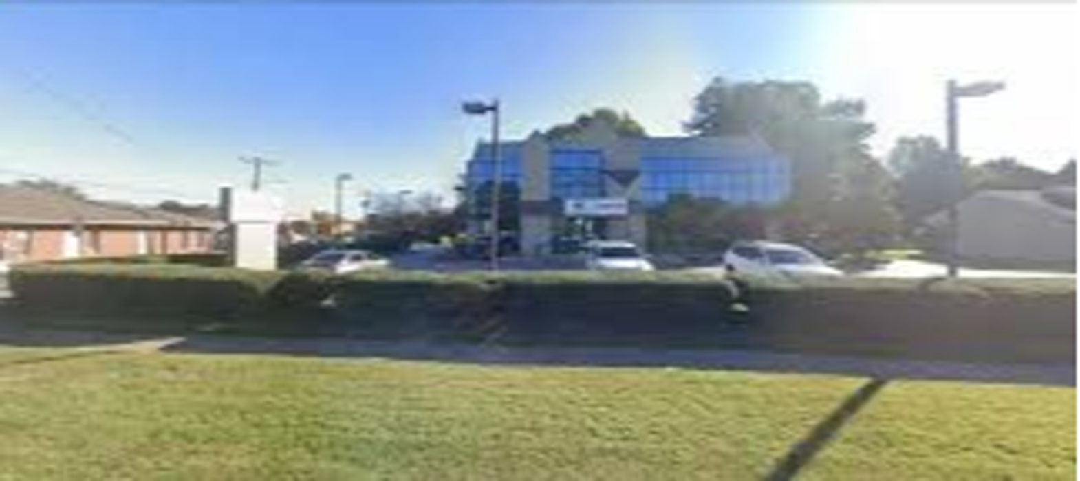 Exterior view of the Men's Wellness Centers Virginia Beach clinic, a LegitScript-certified men's health facility offering testosterone replacement therapy, ED treatment, and medical weight loss on Wildwood Drive.
