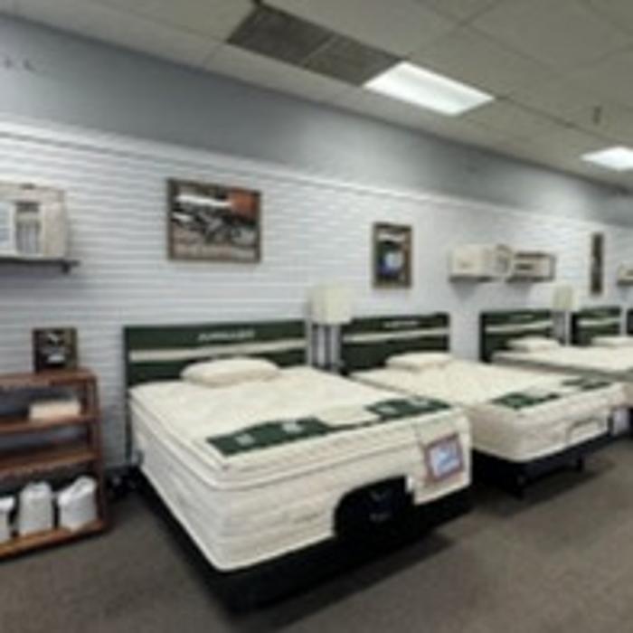 Wide selection of top-brand mattresses displayed in our spacious showroom.