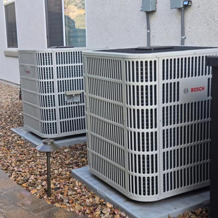 Bosch heat pump outdoor unit installed and set on a secure pad for energy-efficient home comfort in Anaheim, CA.
