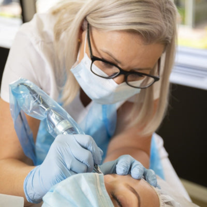 Naomi carrying out professional microblading at The De Peyer Clinic in Durley, Southampton, creating natural looking fuller brows.