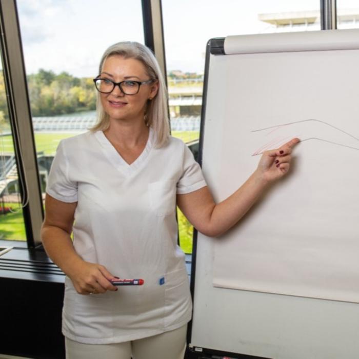 Naomi teaching medical aesthetics at The De Peyer Clinic Training Academy, known for high quality practitioner education.