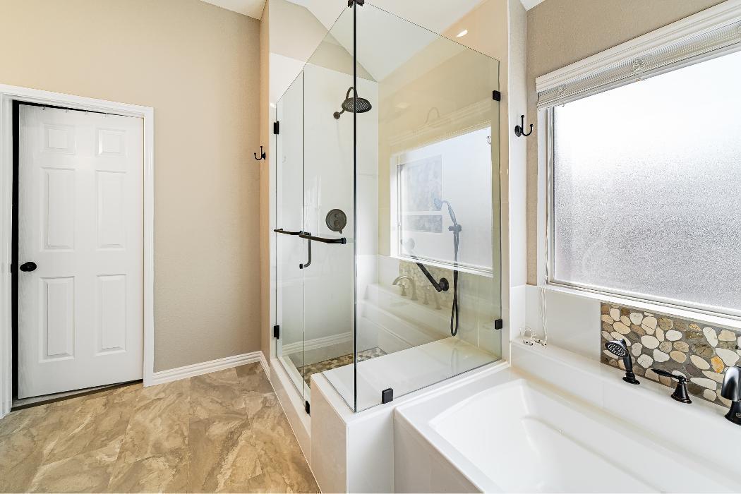 Earthy Toned Bathroom with Shower & Soaking Tub Combo
A warm, neutral-toned bathroom with a natural, earthy character. The space features two distinct bathing zones side by side.