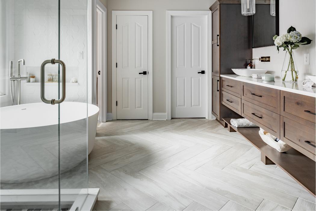 Rustic Modern Master Bathroom with Herringbone Floor
A beautifully spacious and harmonious master bathroom blending warm natural wood tones with clean white surfaces.