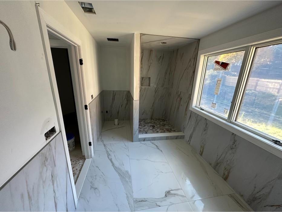 Completed porcelain floor tile installation delivering a clean, modern look with precise alignment and long-lasting durability.