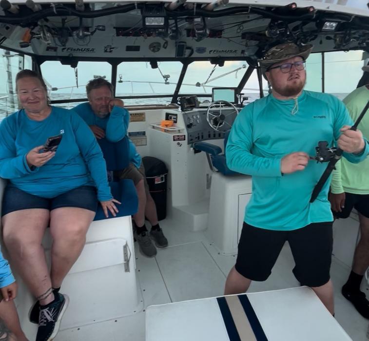 Family group having a great time fishing Lake Erie waters of Lorain, Ohio with Sir Walleye Charters!