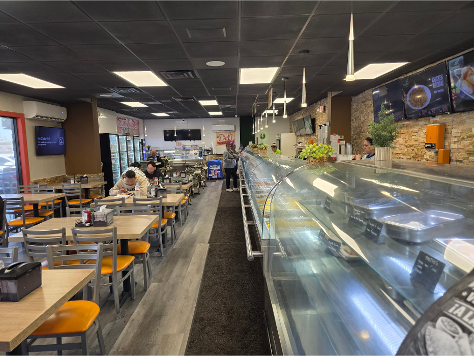 Customers enjoying Dominican lunch inside Riverview Fresh Cuisine in Tampa Florida.