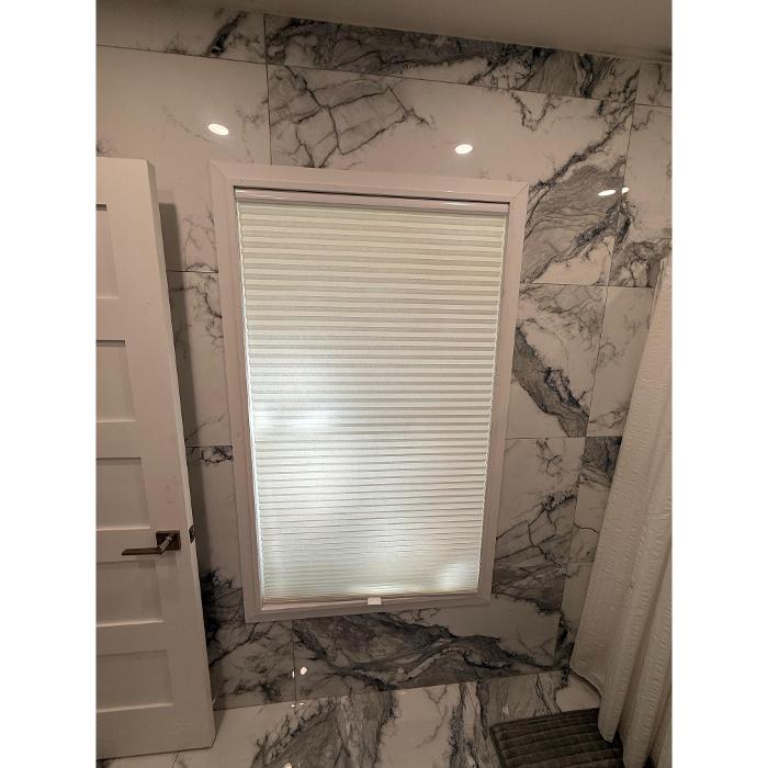 Custom window treatments installation in Pompano Beach by Boca Home Decor featuring motorized shades and modern window coverings.