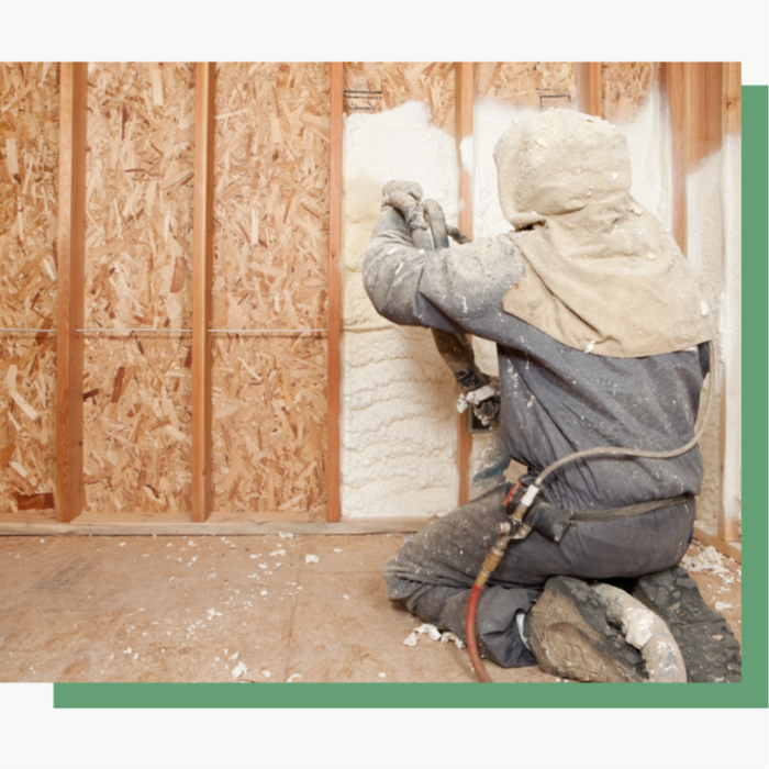 Professional insulation team blowing in high-performance foam insulation into an attic space, creating an airtight thermal barrier to reduce energy costs and improve home comfort.