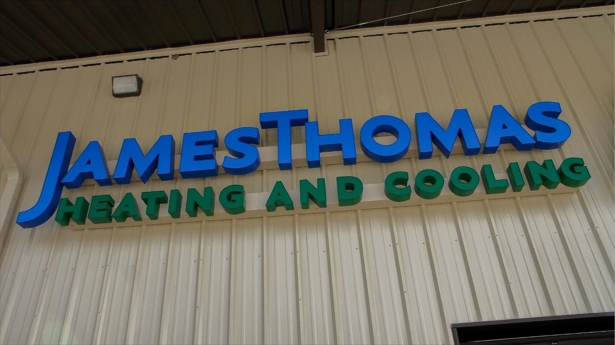 James Thomas Heating and Cooling building sign displayed on the exterior of the company location.