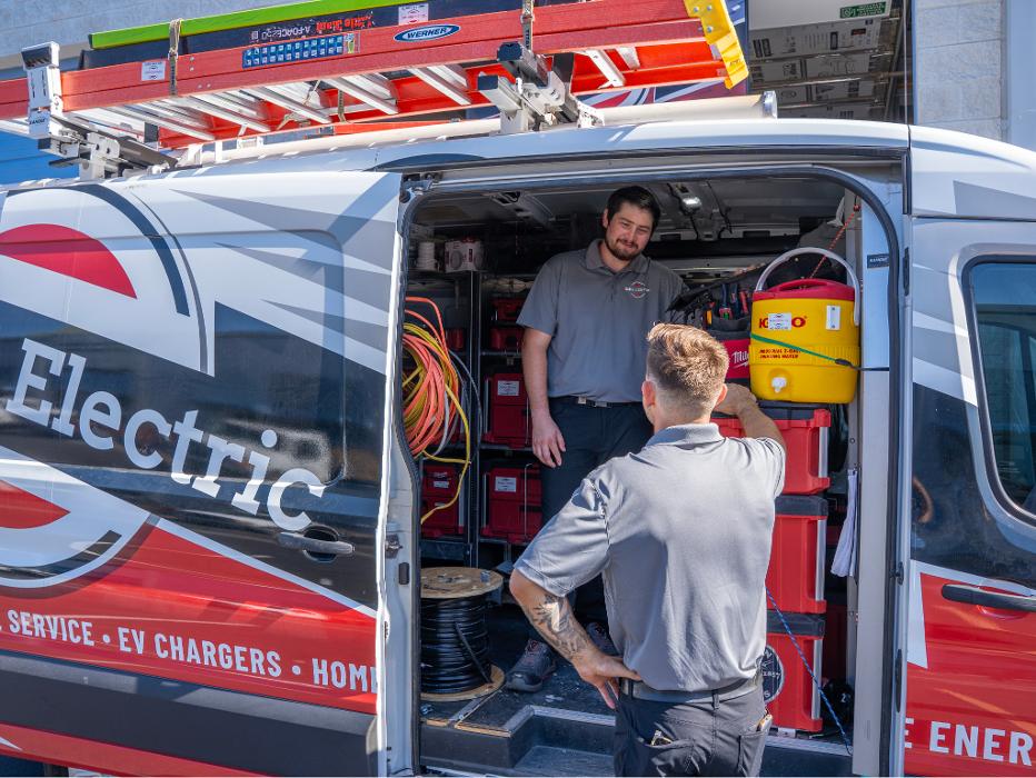 Scheid Electric technician preparing equipment for professional electrical service in Queen Creek.