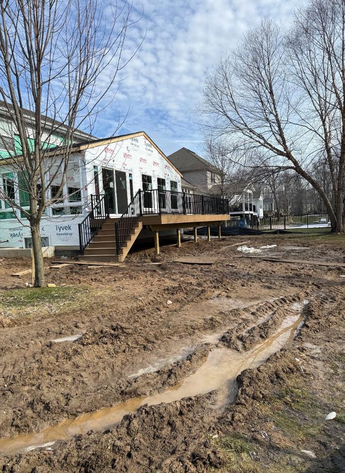 Newly built custom home addition with attached deck on Grand Rapids Home
