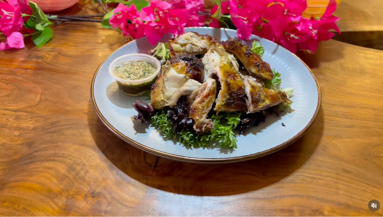 Juicy Thai-style roasted chicken served over rice with fresh herbs and sauce, a comforting and authentic dish loved by locals near Lafayette and the Highway 7 area.