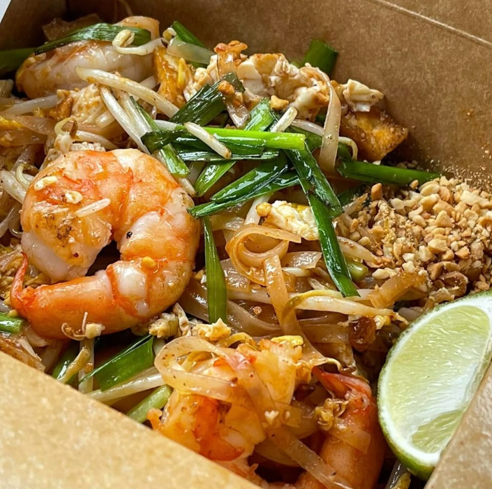 Classic shrimp Pad Thai with stir-fried rice noodles, eggs, bean sprouts, and crushed peanuts&mdash;one of the most popular Thai dishes for takeout near Lafayette, Erie, and Broomfield.