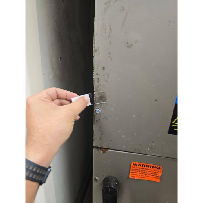 Close-up of a wall surface being inspected for possible moisture, damage, or indoor environmental concerns.