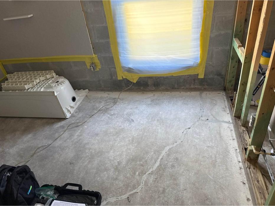 Interior room under assessment for water damage, moisture intrusion, or other indoor environmental concerns during a building health inspection.