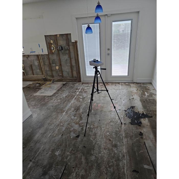 Specialized inspection equipment set up inside a home to measure indoor air quality, moisture, or environmental contaminants.