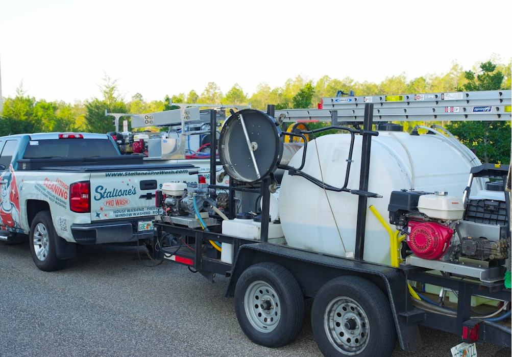 Professional pressure washing setup with trailer and equipment for driveway, house, and exterior cleaning services