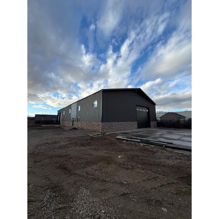 Ground level view of a custom commercial pole barn by Sam Tams Company in Ogden, Utah. Serving Weber County and the Wasatch Front.