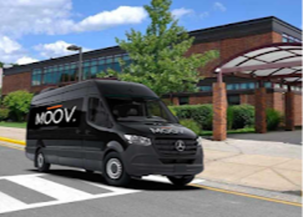 MOOV. mobile unit arriving for an on-site visit, providing concierge musculoskeletal care at a client&rsquo;s location.