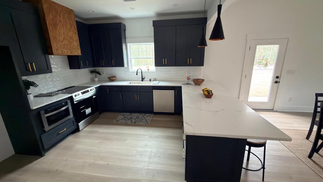 Custom cabinets and quartz countertops project by TS Cabinets in Charleston, SC. High-end custom kitchen cabinets, marble and granite countertops installation, and luxury kitchen remodeling services. 