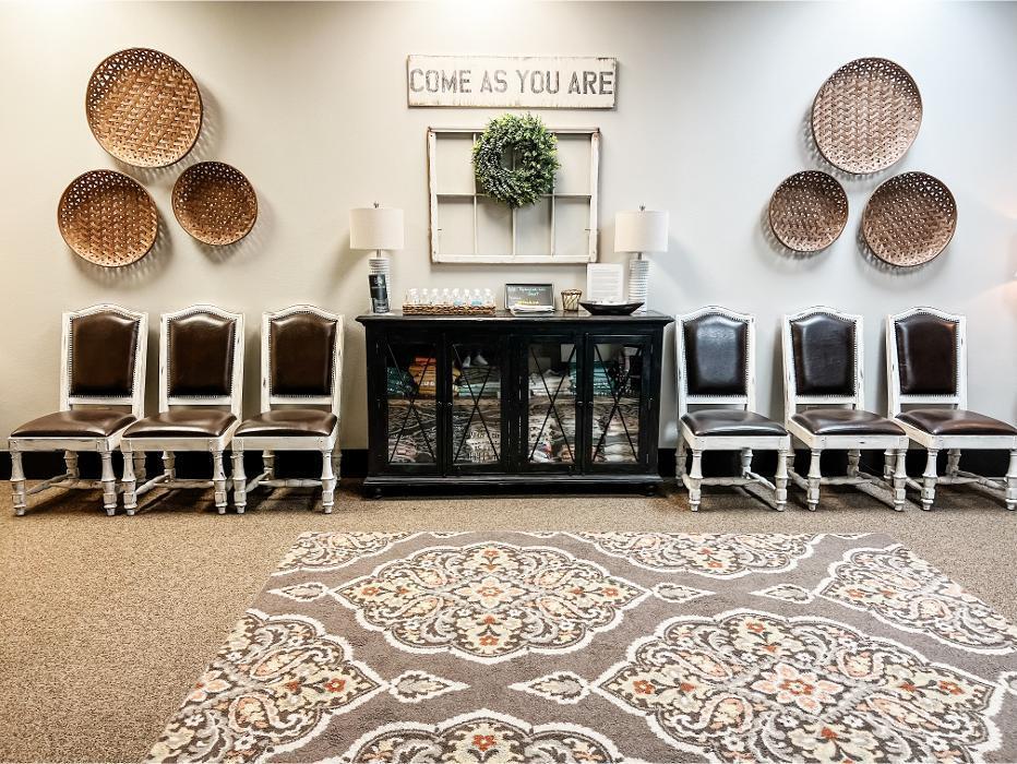 Waiting area at Redeemed Life Counseling in Argyle, TX featuring a “Come As You Are” message, comfortable seating, and a warm, welcoming environment for clients.