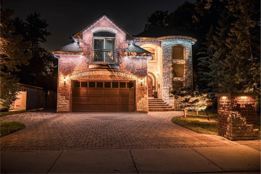 Check out this Glenview home with Trimlights, Downlights and landscape lighting.