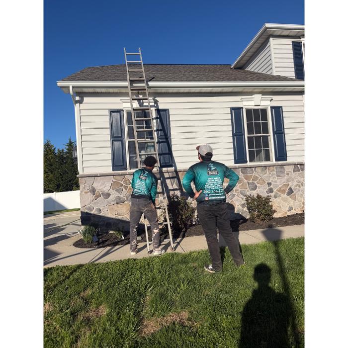 Roof being cleaned in Dover Delaware