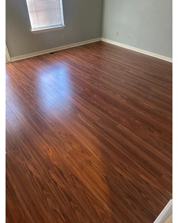 Interior flooring project completed by BisonWorks, featuring clean wood-style flooring installation for a polished and updated home interior.