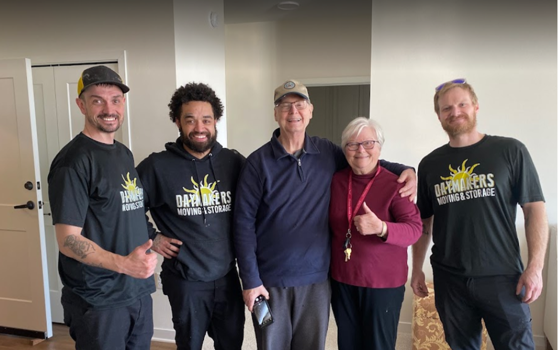 Daymakers Moving & Storage movers pose with happy customers in Lake Elmo, Minnesota.