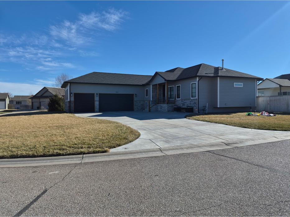 Vinyl siding installation on Wichita KS home by Greenway Exteriors, featuring modern exterior finish and enhanced curb appeal.