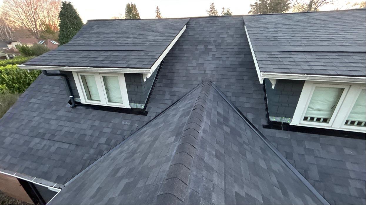 Completed roof replacement on two-story home in Portland OR with high-quality asphalt shingles by KVN Portland Roofing