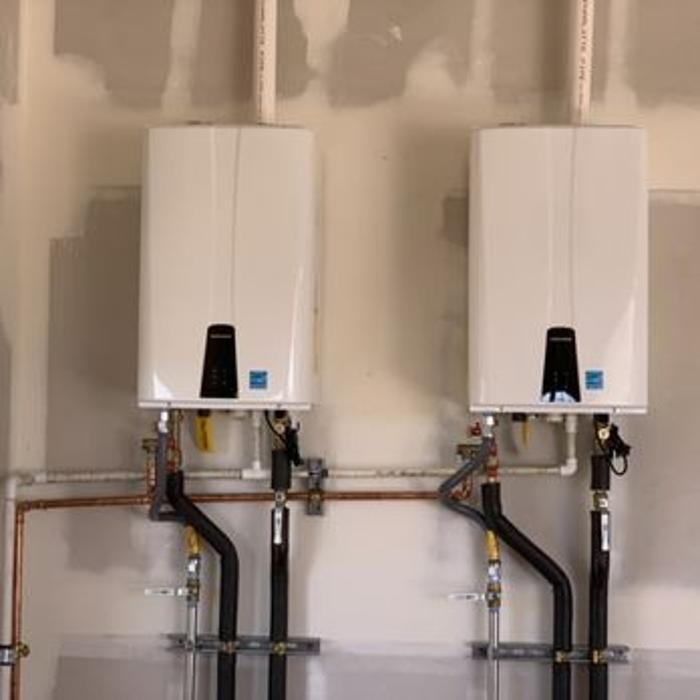 Dual tankless water heaters.