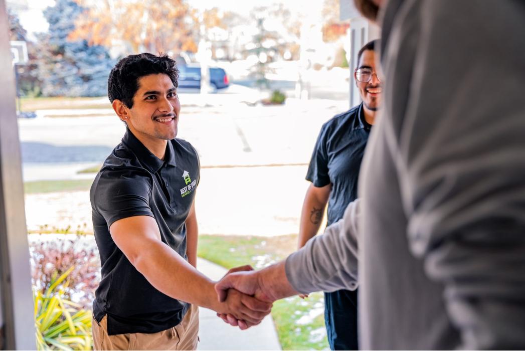 Best of Utah Moving Company movers greet a customer at a Sandy, Utah home