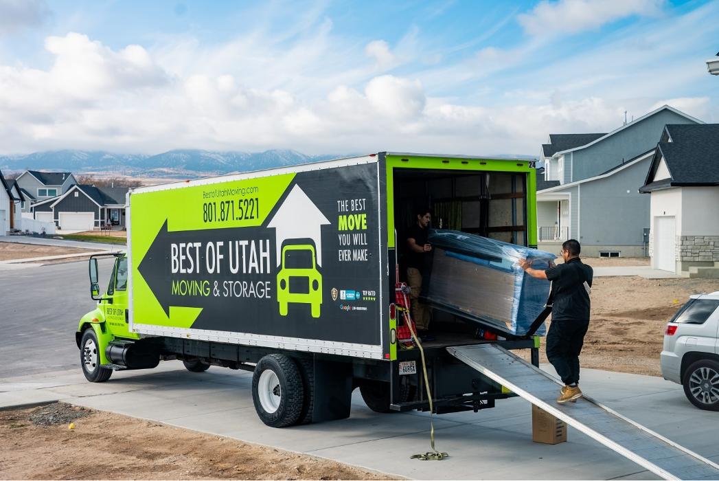 Best of Utah Moving Company truck loading furniture at a home in Sandy, Utah