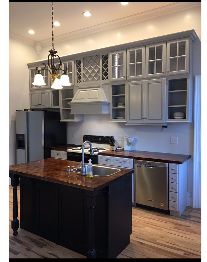 Custom kitchen remodel with gray cabinetry and wood island
