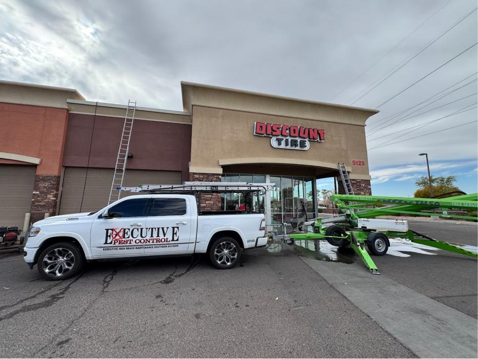 Executive Pest Solutions truck and equipment outside a commercial pest control job in Coolidge, AZ.