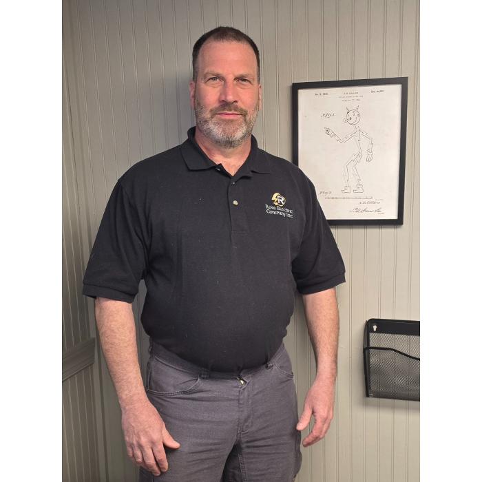 Owner of Rosa Electric Company Inc standing indoors in Vernon CT