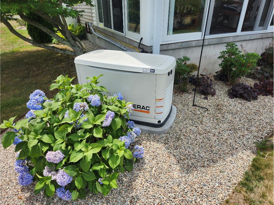 Residential Generac standby generator beside home