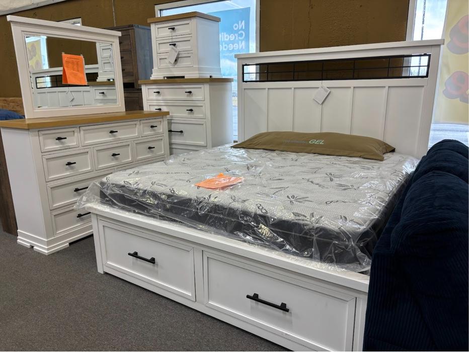 White bedroom set with bed, dresser, and mirror at Furniture & Cabinet Outlet in West Chester Township, Ohio.