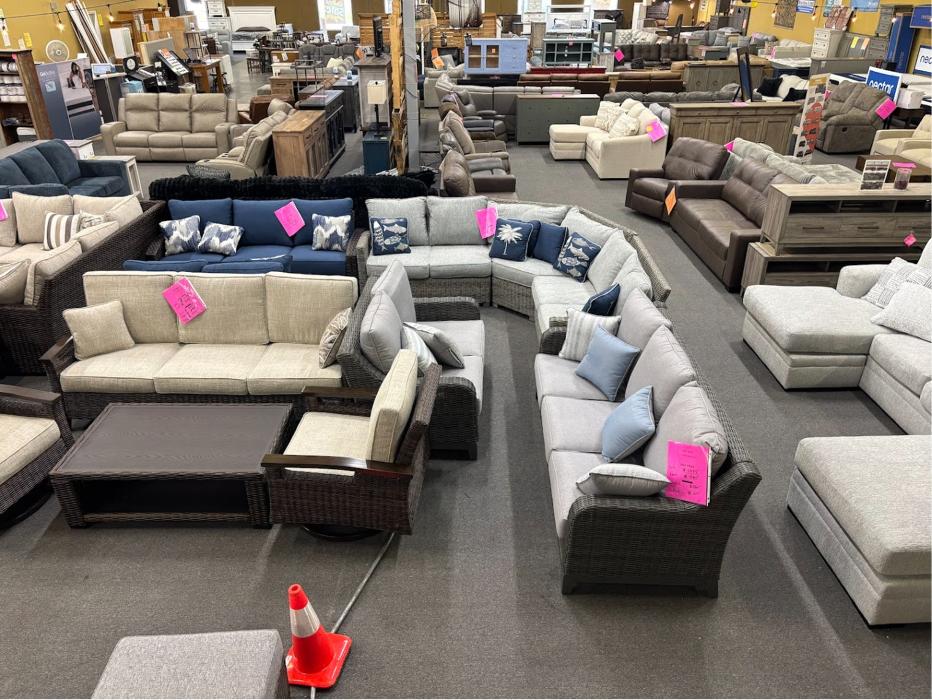 Furniture showroom with patio sets and sofas at Furniture & Cabinet Outlet in West Chester Township, Ohio.