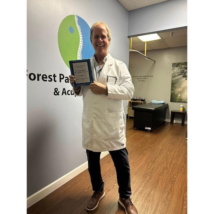 Dr. Reed Moeller of Forest Park Chiropractic & Acupuncture proudly displays the 2025 Best of Cincinnati Award recognizing the practice&rsquo;s commitment to chiropractic care, acupuncture, rehabilitation, and wellness services in Cincinnati, Ohio.