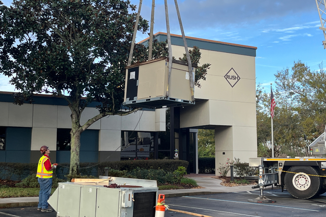 Lifting HVAC equipment for a roof installation