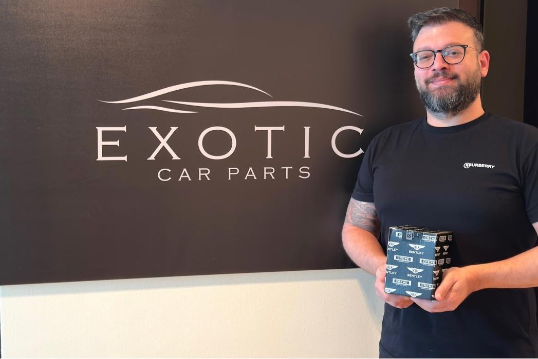 Exotic Car Parts team member showcasing genuine Bentley OEM inventory. Our experienced staff helps customers locate the correct luxury vehicle parts with confidence.