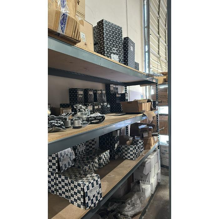Warehouse stocked with genuine Bentley and Rolls-Royce parts including suspension, braking, electrical, and restoration components available for immediate shipping.
