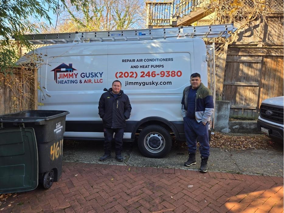 Jimmy Gusky Heating & Air team standing beside their HVAC service van in Washington, DC.