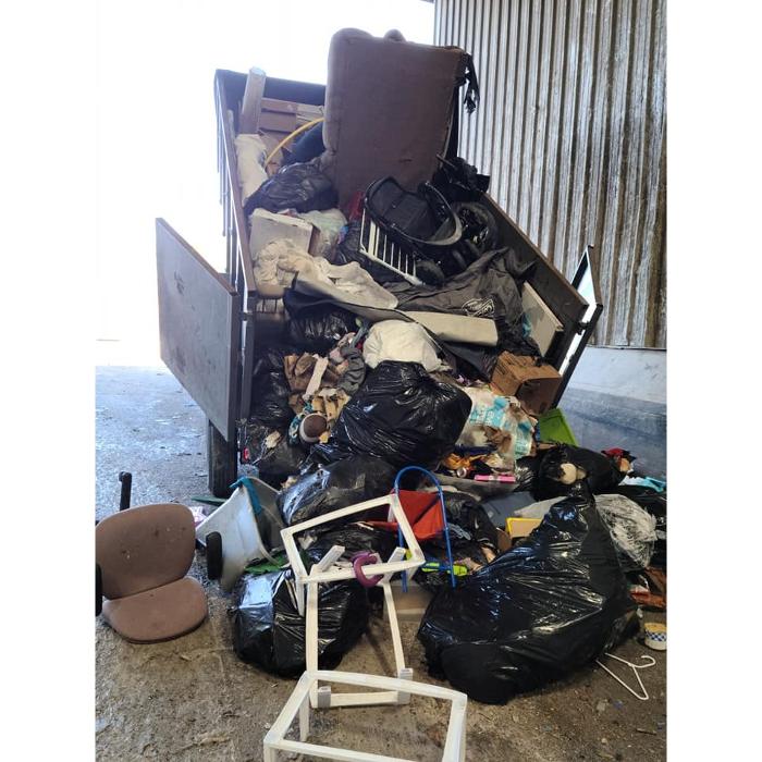 A full load of household junk and furniture collected for hauling by Chums Junk Removal.